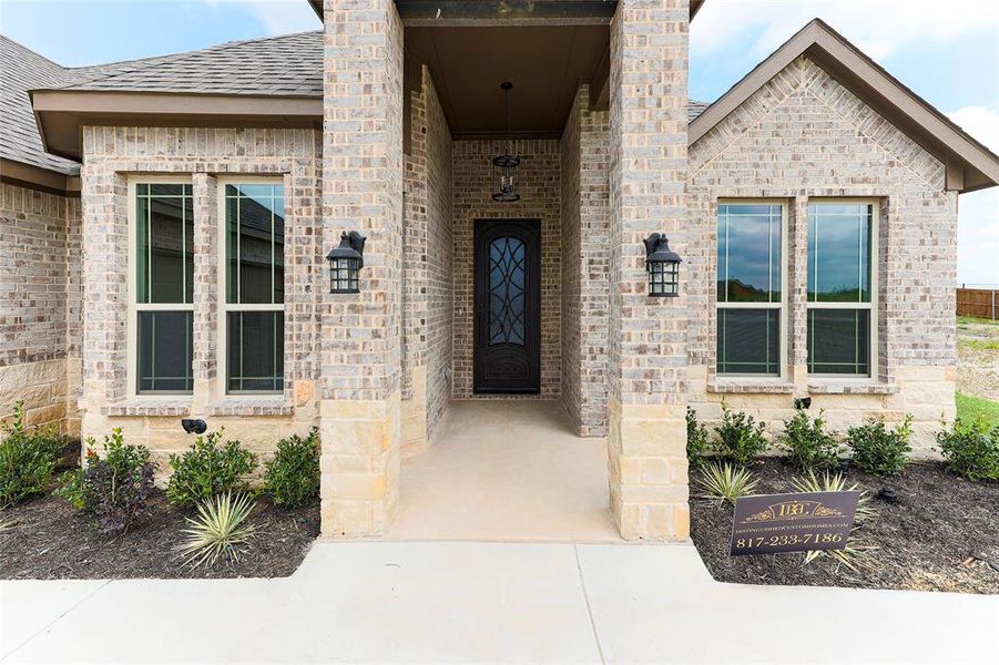 Front exterior of a new home in , Venus, TX, highlighting curb appeal (Image 18).
