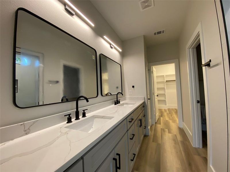 Bathroom featuring vanity and hardwood / wood-style flooring