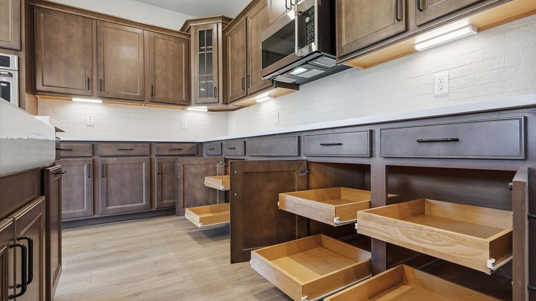 Chef-ready kitchen with abundant storage and stainless steel appliances located at Pinebrook