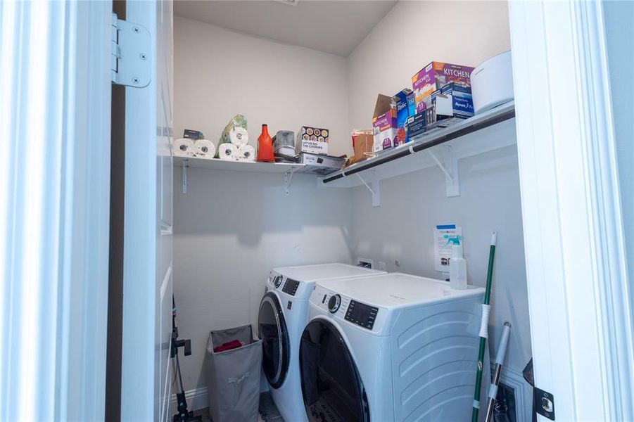 Washroom featuring washing machine and clothes dryer