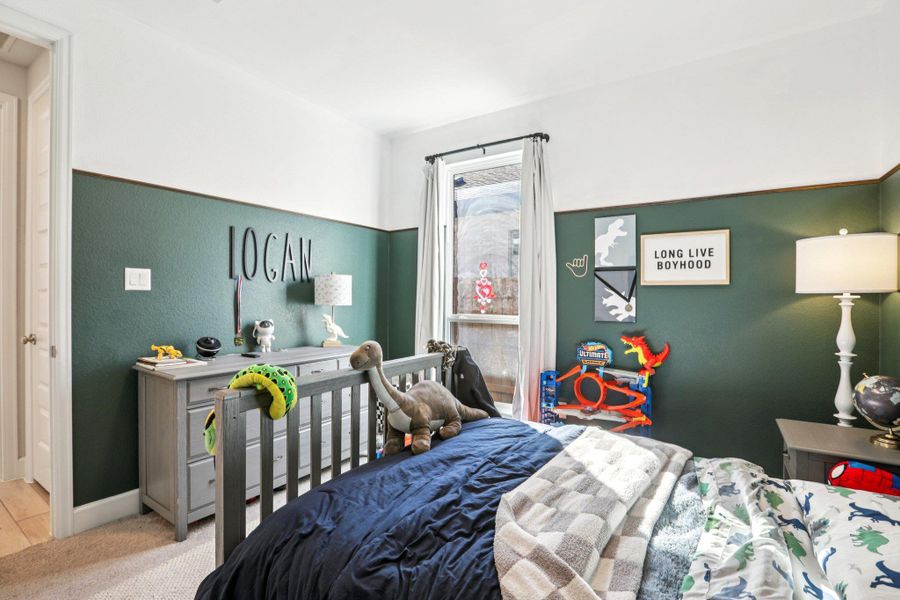 Carpeted bedroom with baseboards