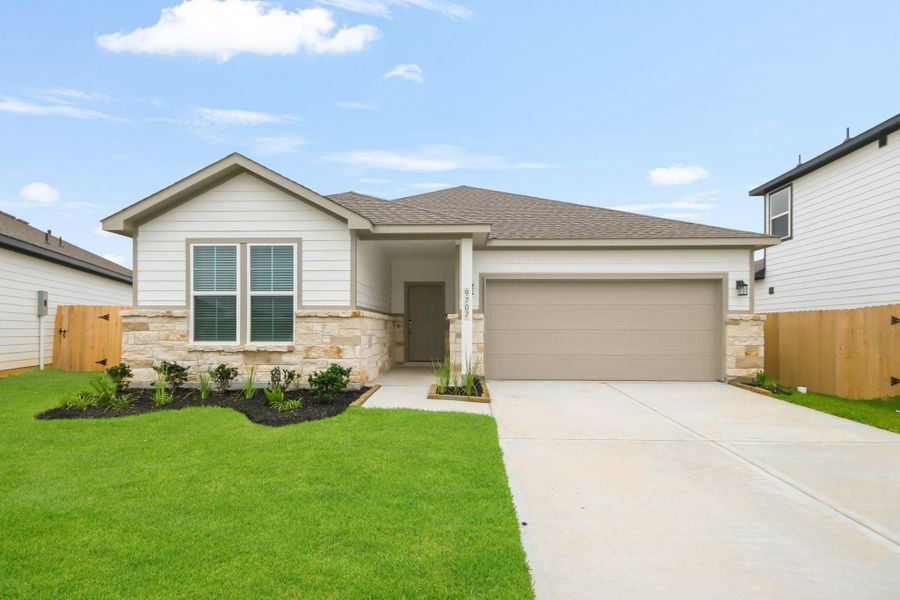 Front exterior of a new home in Caney Mills, Conroe, TX, highlighting curb appeal (Image 1). Front exterior of a new home in Caney Mills, Conroe, TX, highlighting curb appeal (Image 1).