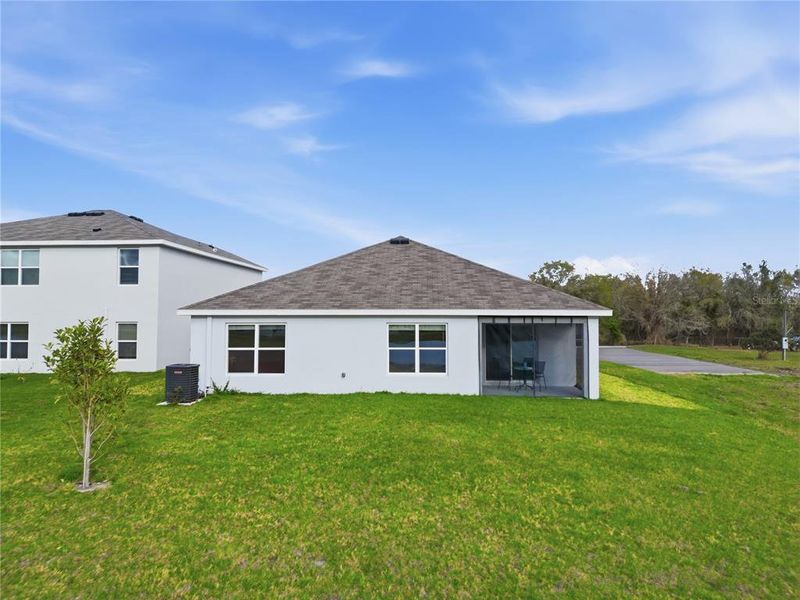 Exterior details and patio area of a home in Berry Bay, Wimauma (Image 25).