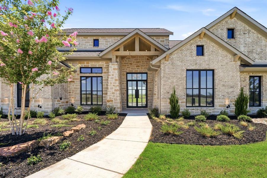 Front exterior of a new home in Fleming Pointe, Fort Worth, TX, highlighting curb appeal (Image 22). Front exterior of a new home in Fleming Pointe, Fort Worth, TX, highlighting curb appeal (Image 22).