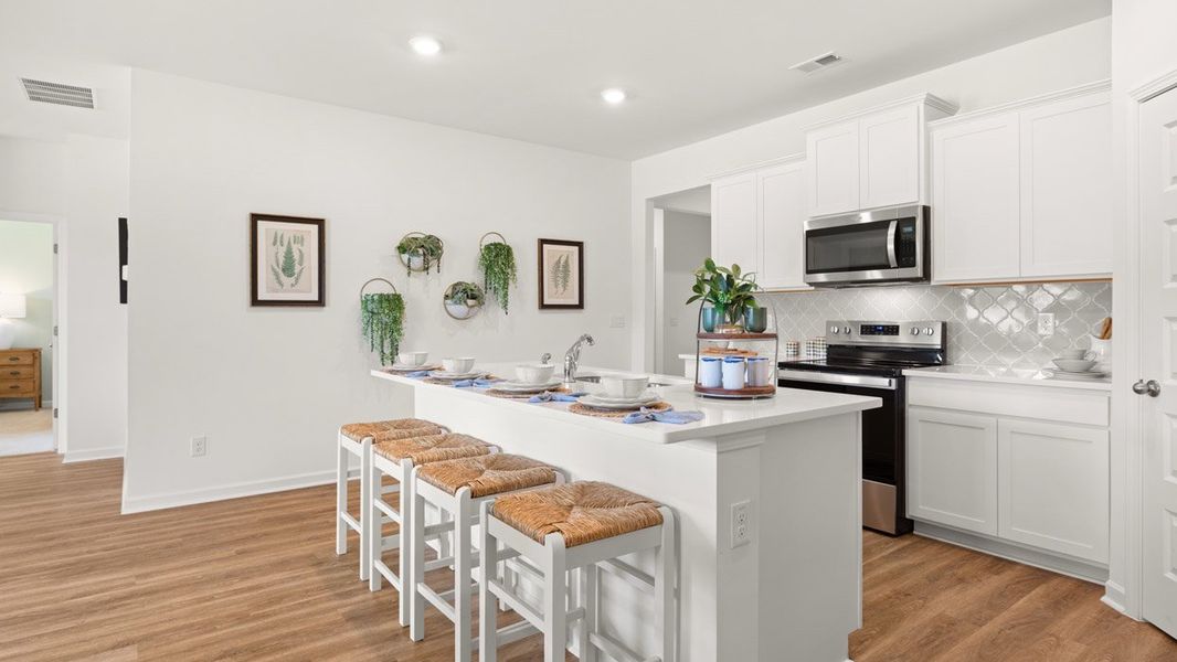 Representative furnished interior of a home built from the Cali by D.R. Horton in Champion's Run, Lithonia (Image 4).