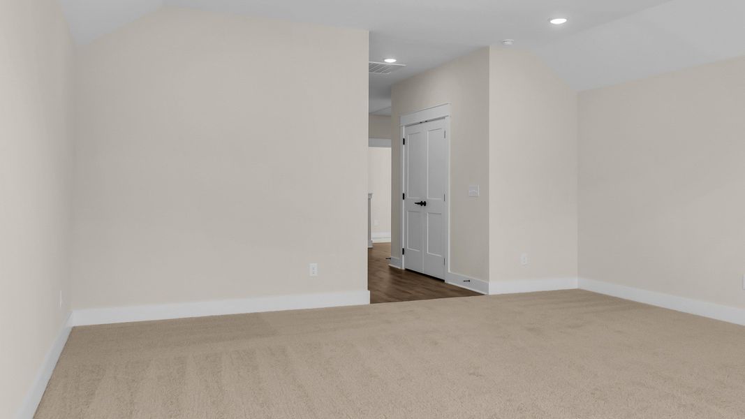 Second floor bonus room with vaulted ceiling (Representative of finished home)