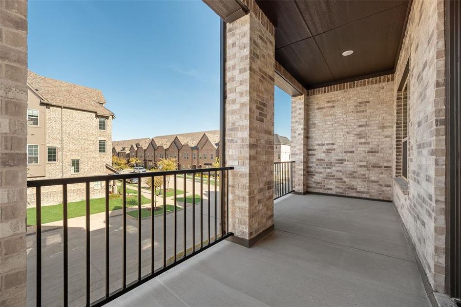 Exterior details and patio area of a home in Wade Settlement Townhomes, Frisco (Image 17).