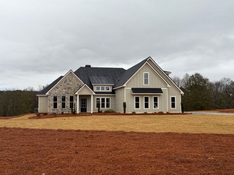 Front exterior of a new home in Blackwelder Bluff, Bowdon, GA, highlighting curb appeal (Image 1).