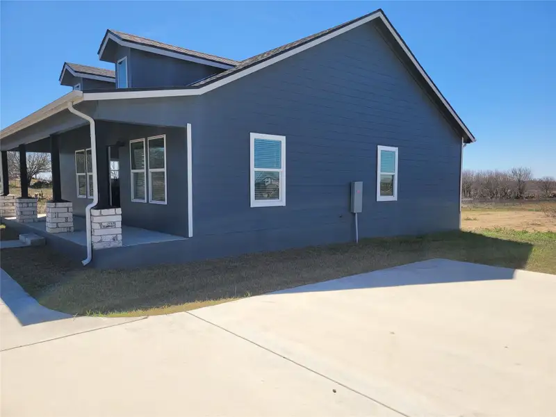 View of property exterior with a porch