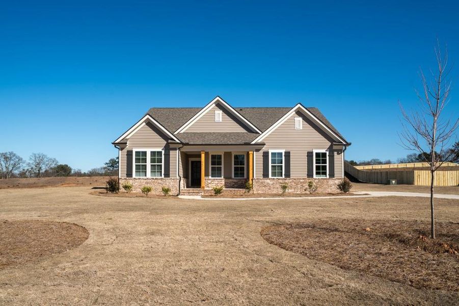Front exterior of a new home in Magnolia Ridge, Monroe, GA, highlighting curb appeal (Image 23).