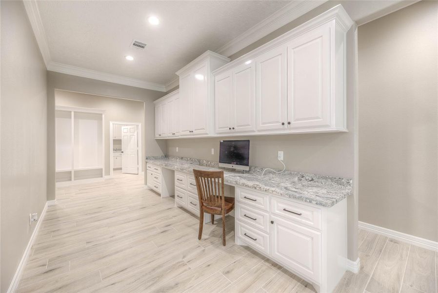 Office area with granite countertops and cabinets for storage (Building A) Office area with granite countertops and cabinets for storage (Building A)