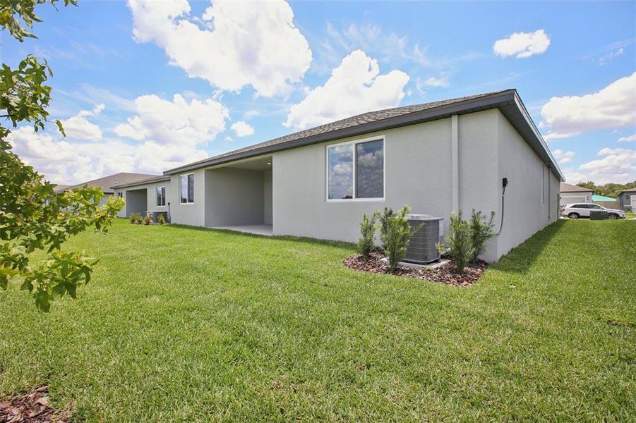Front exterior of a new home in Two Rivers - Signature Series, Zephyrhills, FL, highlighting curb appeal (Image 17).