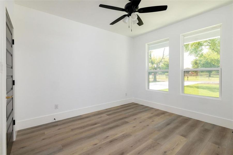 Spare room with ceiling fan and hardwood / wood-style floors