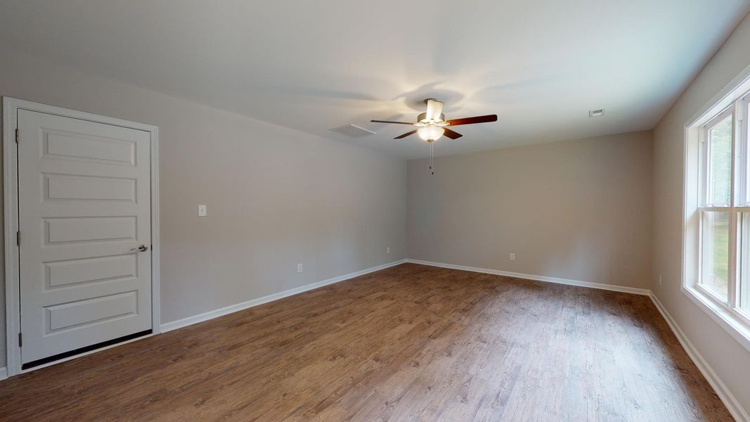 Representative unfurnished interior of a home built from the Kids 2 Car by JC Jackson Homes,LLC in Heritage Pointe, Newport (Image 14).