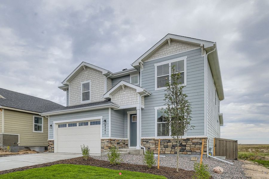 Front exterior of a new home in Sterling Ranch 50s, Colorado Springs, CO, highlighting curb appeal (Image 2).