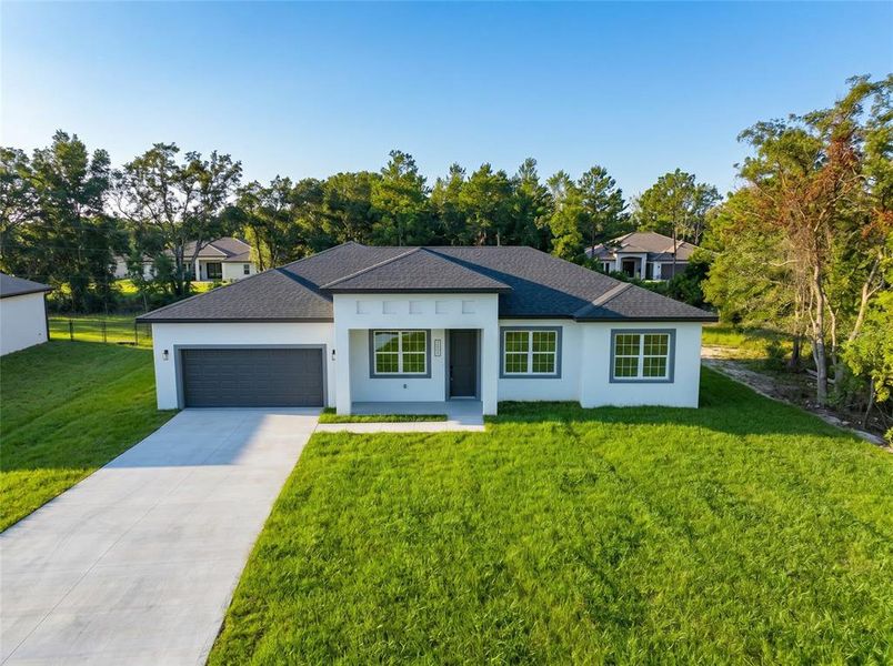 Front exterior of a new home in , Ocala, FL, highlighting curb appeal (Image 21). Front exterior of a new home in , Ocala, FL, highlighting curb appeal (Image 21).