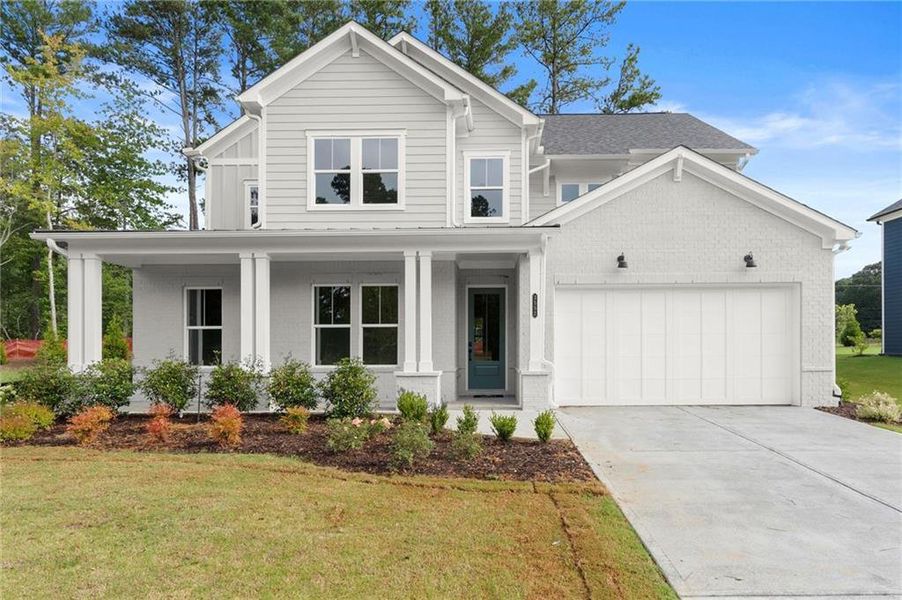 Front exterior of a new home in Hillgrove Preserve, Powder Springs, GA, highlighting curb appeal (Image 2).