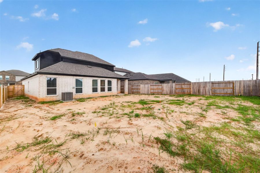 Exterior details and patio area of a home in Sunterra, Katy (Image 31).