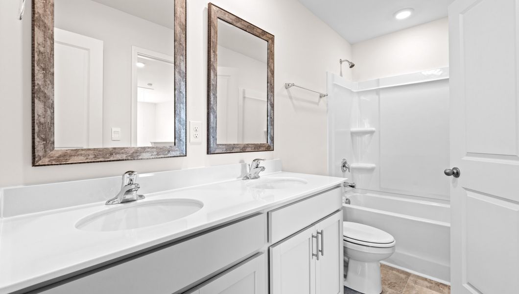 Representative furnished interior of a home built from the Biltmore by D.R. Horton in Hunters Ridge, Woodruff (Image 11).