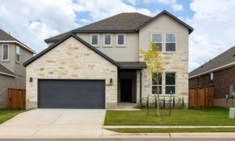 Front exterior of a new home in , Kyle, TX, highlighting curb appeal (Image 2).