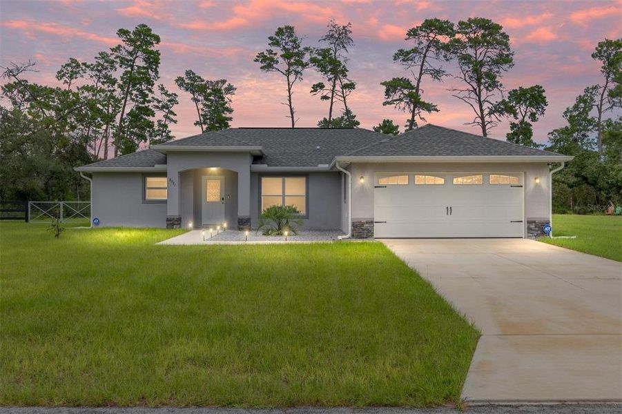 Front exterior of a new home in , Dunnellon, FL, highlighting curb appeal (Image 2).