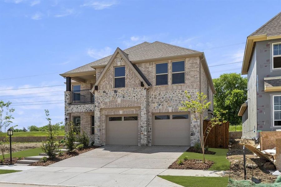 Front exterior of a new home in Inspiration, Seis Lagos, TX, highlighting curb appeal (Image 1). Front exterior of a new home in Inspiration, Seis Lagos, TX, highlighting curb appeal (Image 1).