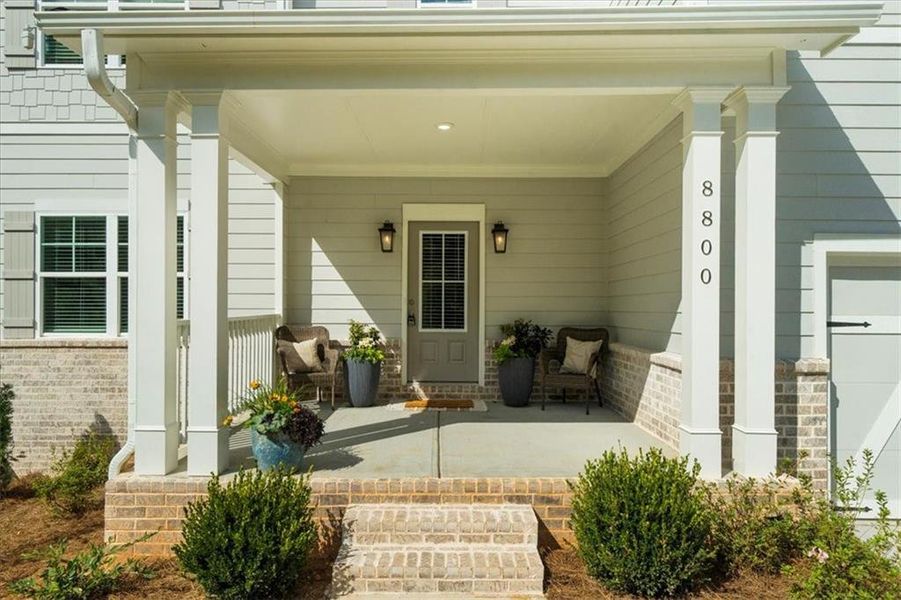 Exterior details and patio area of a home in River Rock, Ball Ground (Image 3).