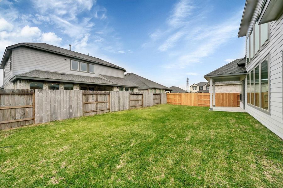 Exterior details and patio area of a home in Canterra Creek  60', Iowa Colony (Image 26).