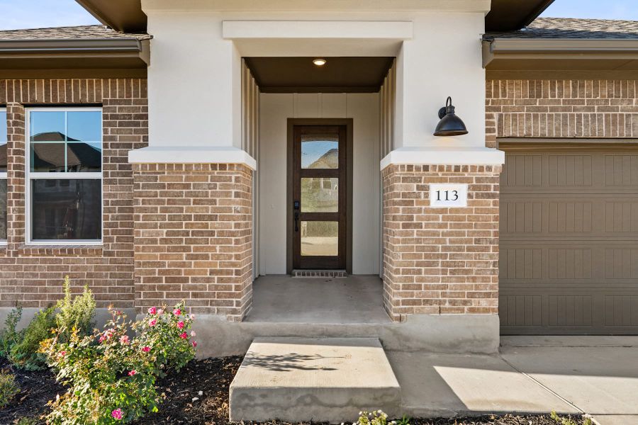 Exterior details and patio area of a home in Lariat, Liberty Hill (Image 3).