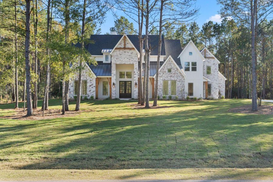 Front exterior of a new home in , Montgomery, TX, highlighting curb appeal (Image 2). Front exterior of a new home in , Montgomery, TX, highlighting curb appeal (Image 2).