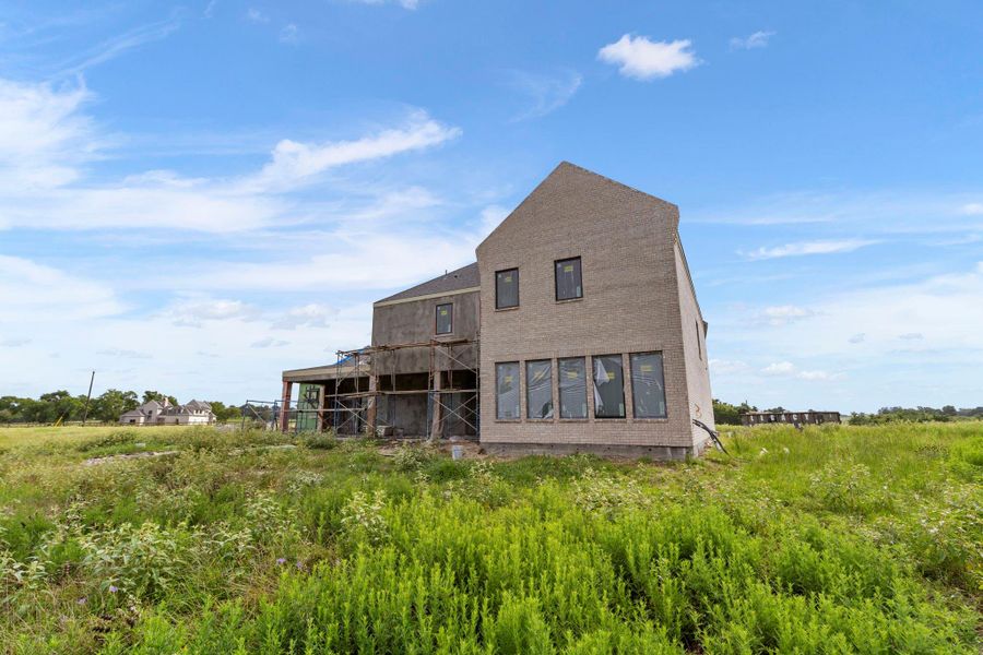 Front exterior of a new home in , Washington, TX, highlighting curb appeal (Image 1).
