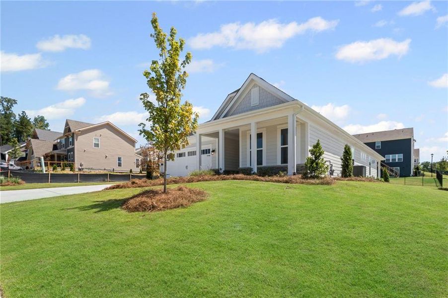 Front exterior of a new home in Twin Lakes, Hoschton, GA, highlighting curb appeal (Image 25). Front exterior of a new home in Twin Lakes, Hoschton, GA, highlighting curb appeal (Image 25).