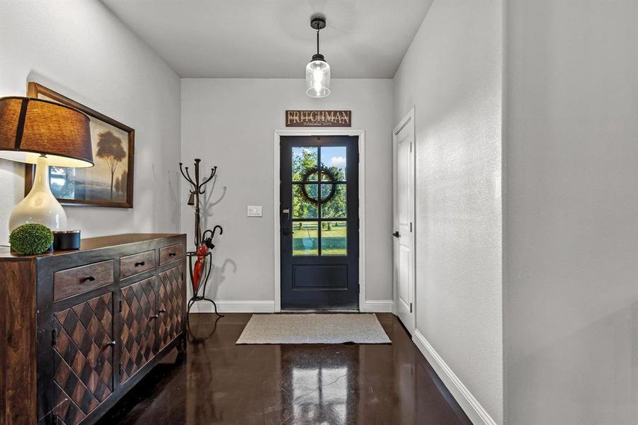 Foyer featuring baseboards Foyer featuring baseboards