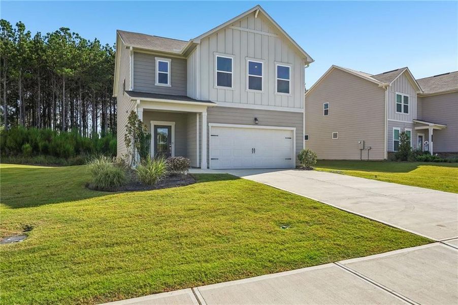 Front exterior of a new home in Heritage River, Euharlee, GA, highlighting curb appeal (Image 2). Front exterior of a new home in Heritage River, Euharlee, GA, highlighting curb appeal (Image 2).