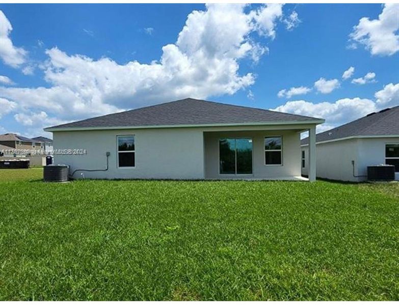 Front exterior of a new home in Lake Lucerne, Winter Haven, FL, highlighting curb appeal (Image 1). Front exterior of a new home in Lake Lucerne, Winter Haven, FL, highlighting curb appeal (Image 1).