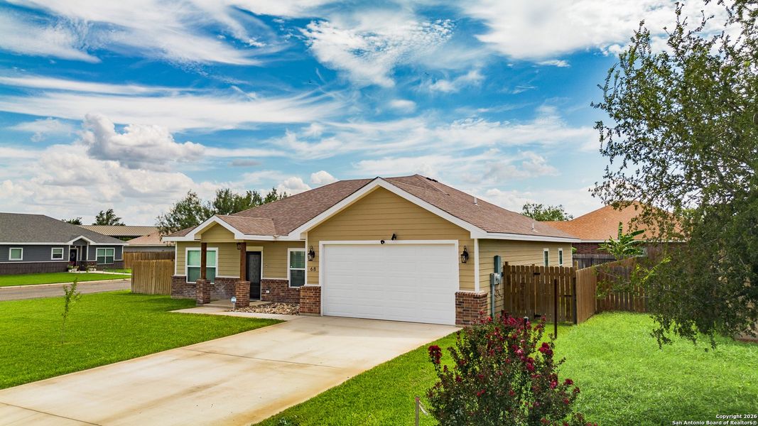 Front exterior of a new home in , Uvalde, TX, highlighting curb appeal (Image 24).