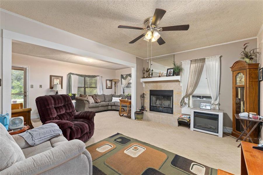 Living room has a woodburning fireplace