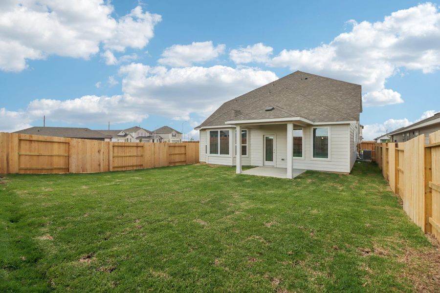 Exterior details and patio area of a home in Sanford Farms - Premier Series, Waller (Image 25).