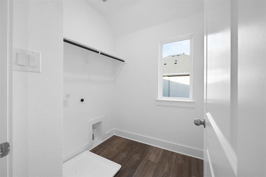 Clothes washing area featuring hookup for a gas dryer, dark hardwood / wood-style floors, and hookup for an electric dryer