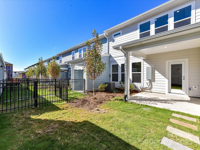 Exterior details and patio area of a home in North Creek Village - Townhomes, Huntersville (Image 22).
