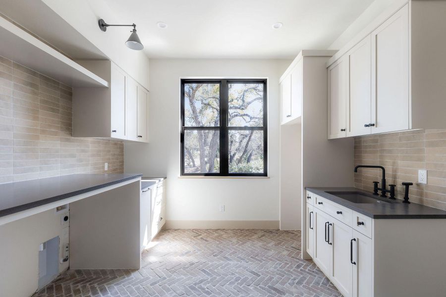 Huge laundry room with tons of storage!