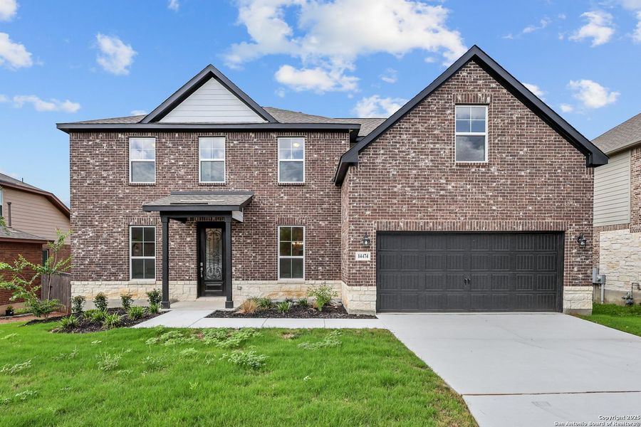Front exterior of a new home in Ladera, San Antonio, TX, highlighting curb appeal (Image 5).