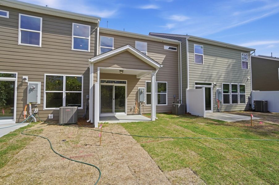 Exterior details and patio area of a home in Harrisburg Village Townhomes, Harrisburg (Image 30).