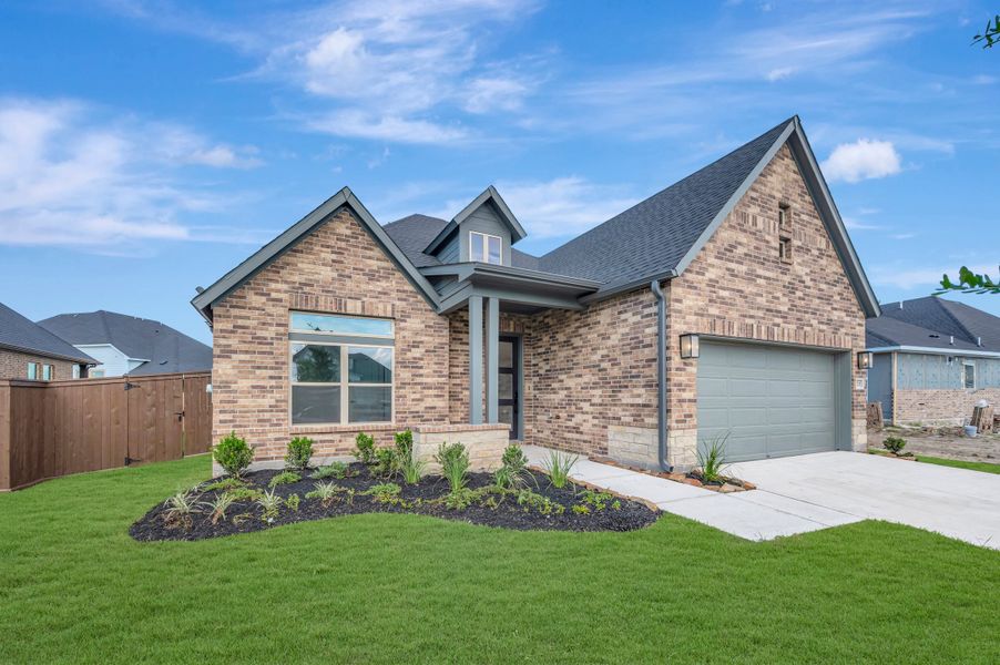 Front exterior of a new home in Beacon Point at Lago Mar - Retreat Collection, Texas City, TX, highlighting curb appeal (Image 2).