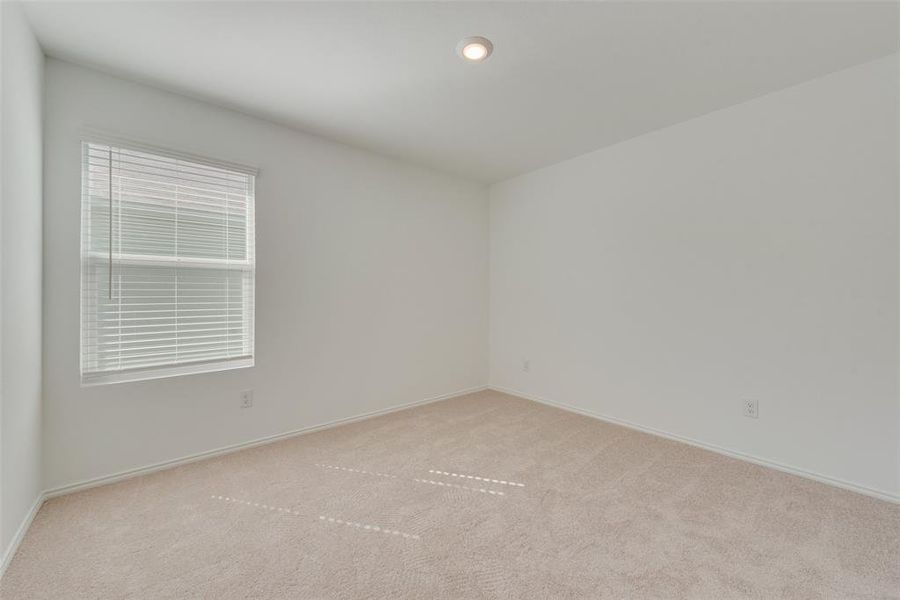 Unfurnished room with light colored carpet