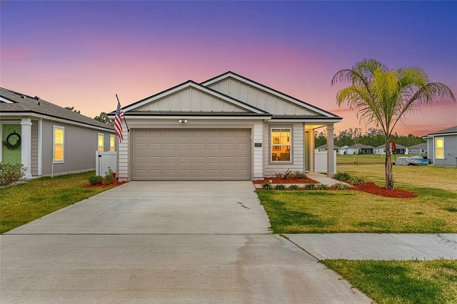 Front exterior of a new home in , Bunnell, FL, highlighting curb appeal (Image 25).