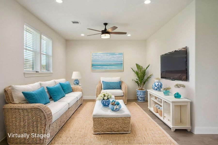 Virtually Staged Living room featuring visible vents, baseboards, wood finished floors, recessed lighting, and a ceiling fan Virtually Staged Living room featuring visible vents, baseboards, wood finished floors, recessed lighting, and a ceiling fan