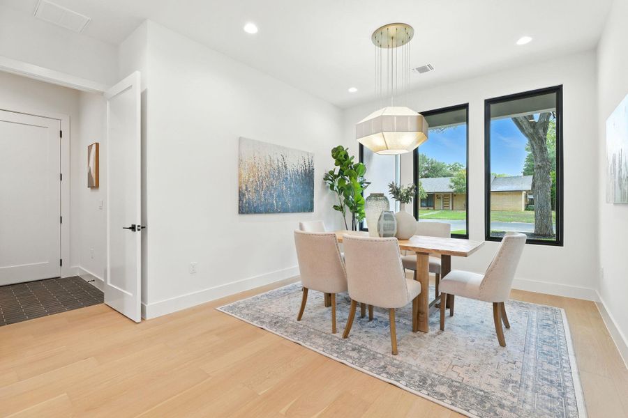 Dining area featuring recessed lighting and light wood finished floors Dining area featuring recessed lighting and light wood finished floors