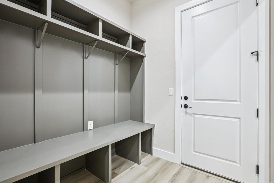 Mudroom with light wood-style flooring