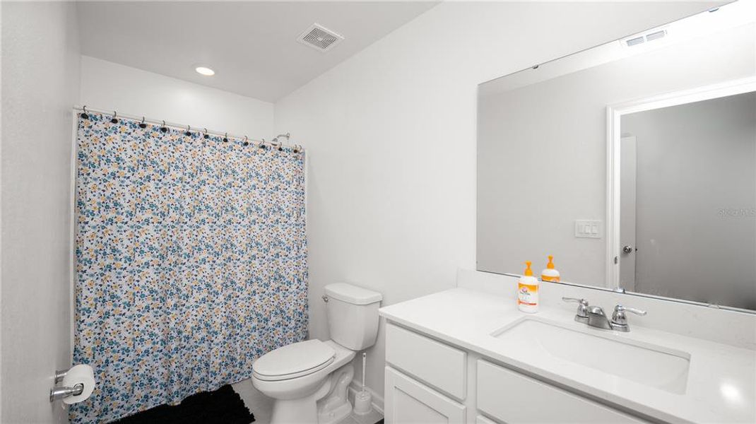 Furnished interior view inside a new home in Peace Creek Reserve: Legacy Collection, Winter Haven (Image 9).